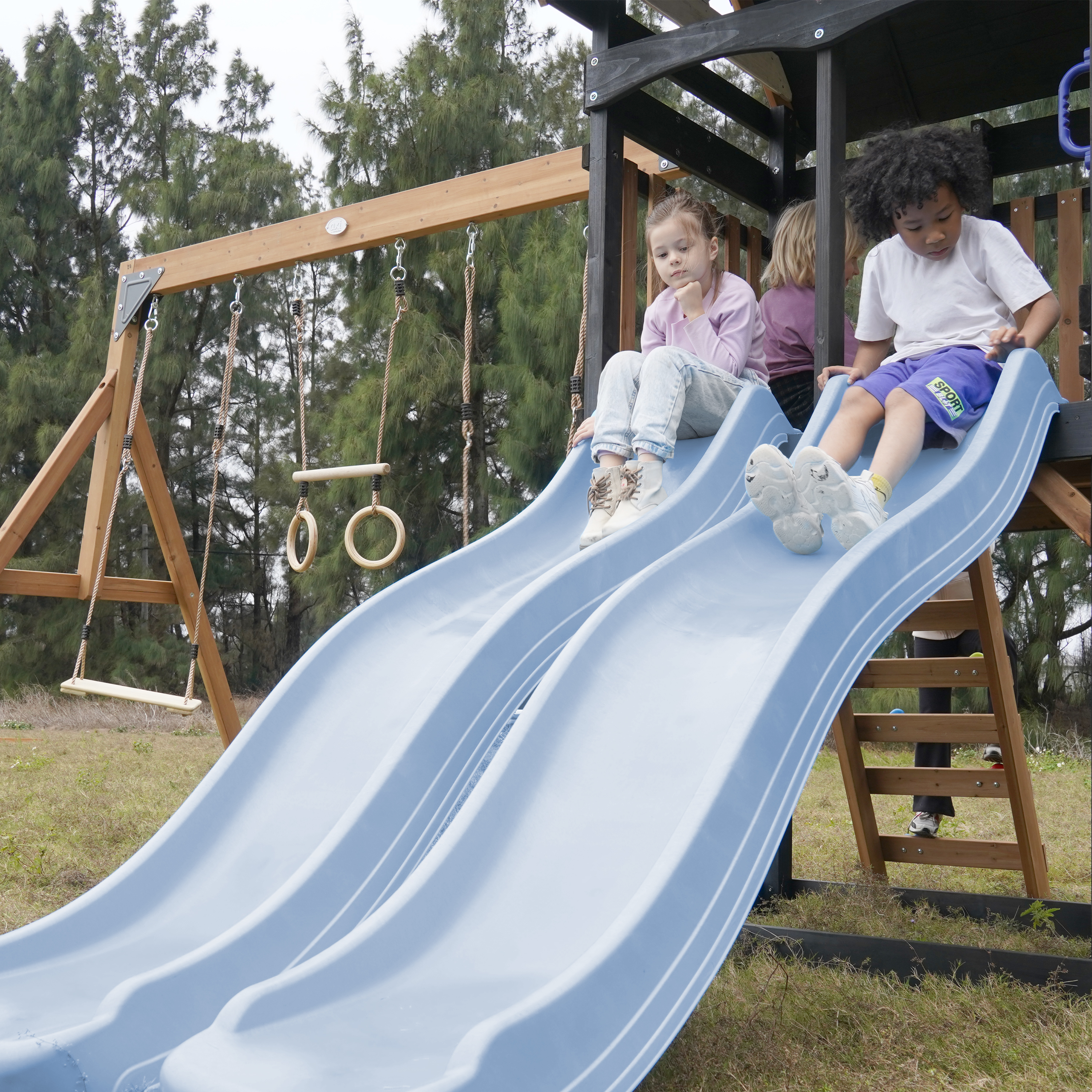 AXI Cody Climbing Frame with Swings, Trapeze and Climbing Wall – Pastel Blue Double Slide and Tube Slide