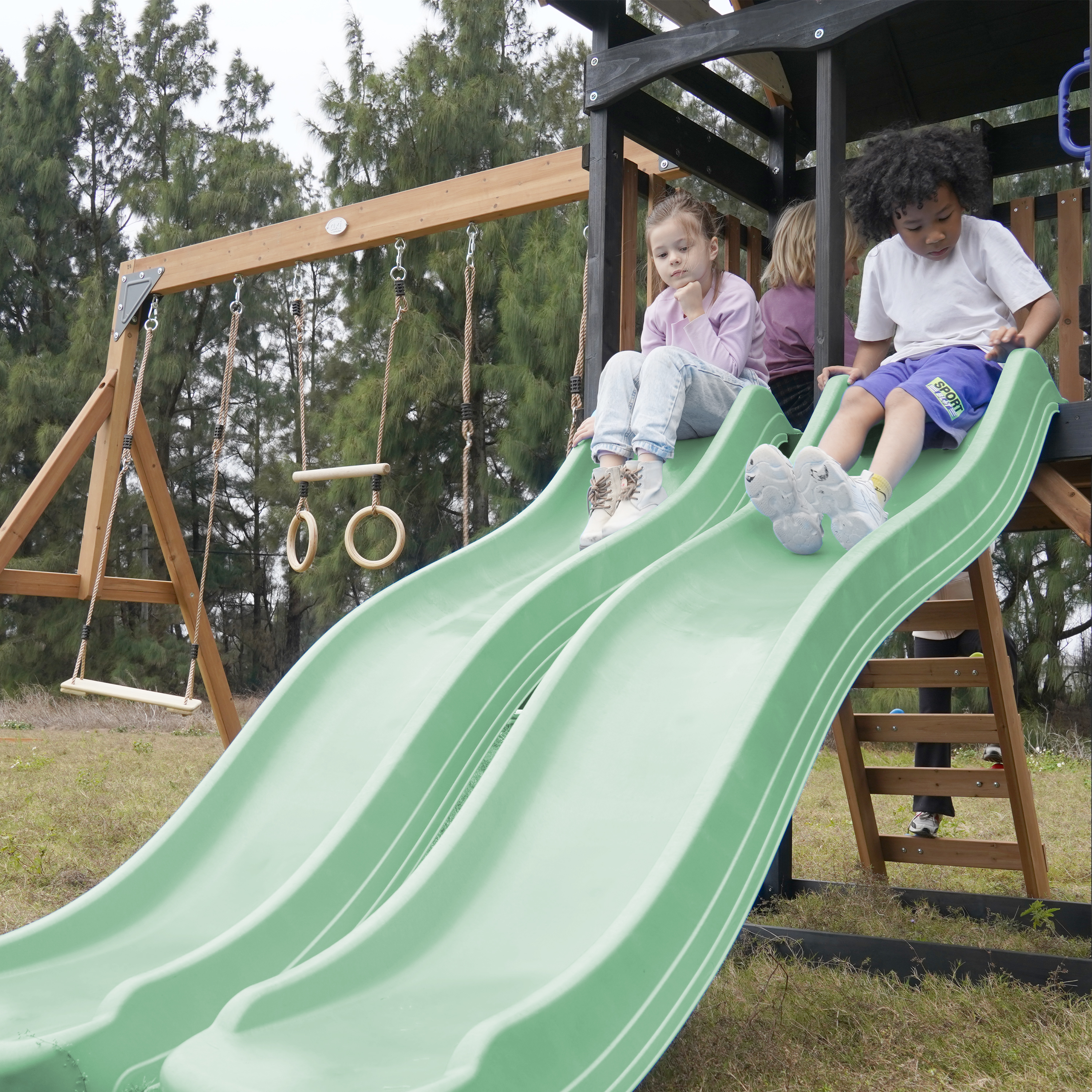 AXI Cody Climbing Frame with Swings, Trapeze and Climbing Wall – Pastel Green Double Slide and Tube Slide